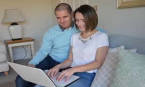 Young couple researching how to buy more shares in their home